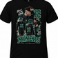A black short-sleeve graphic t-shirt featuring football player Jalen Hurts in a black and green uniform, with the number 12, the text 'BUILT IN THE MINE', 'MINERS', and 'EL DIAMANTE' printed on the front.